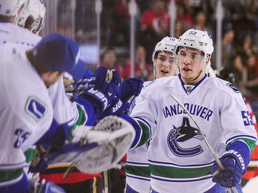 Bo Horvat #53 of the Vancouver Canucks celebrates with the bench after scoring against the Calgary Flames during an NHL game at Scotiabank Saddledome on April 7, 2016 in Calgary, Alberta, Canada. (Photo by Derek Leung/Getty Images)