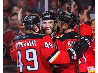 Mikael Backlund #11 (R)  of the Calgary Flames celebrates after scoring against the Vancouver Canucks during an NHL game at Scotiabank Saddledome on April 7, 2016 in Calgary, Alberta, Canada. (Photo by Derek Leung/Getty Images)