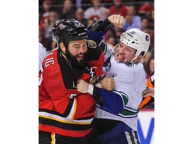 Brandon Bollig #52 of the Calgary Flames fights Derek Dorsett #15 of the Vancouver Canucks during an NHL game at Scotiabank Saddledome on April 7, 2016 in Calgary, Alberta, Canada. (Photo by Derek Leung/Getty Images)