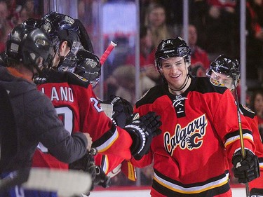 Joe Colborne #8 of the Calgary Flames celebrates with his teammates after scoring against the Vancouver Canucks during an NHL game at Scotiabank Saddledome on April 7, 2016 in Calgary, Alberta, Canada. (Photo by Derek Leung/Getty Images)