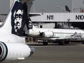 This file photo taken on September 25, 2006 shows Alaska Airlines planes at Seattle-Tacoma International Airport. Alaska Airlines parent company Alaska Air Group said on April 4, 2016 it was acquiring Virgin America in a friendly takeover worth around $4 billion including debt to create the US's fifth-largest airline.A definitive merger agreement had been unanimously approved by the boards of both companies, it said in a statement.