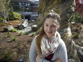 Selina Perry, a former homeless high school student who beat the odds by graduating and going on to university, stands in the friendship garden outside of the University of the Fraser Valley.