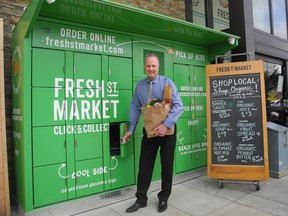 H.Y. Louie director of marketing Mark McCurdy shows Fresh St. Market's new refrigerated pickup lockers at the Fresh. St. Market in West Vancouver.