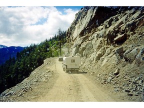 Archival photo of the gravel Freedom Road into Bella Coola, now part of Highway 20. It remains largely unchanged today.