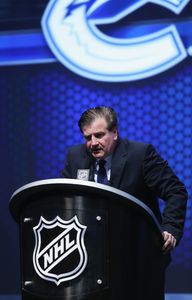 PHILADELPHIA, PA - JUNE 27: Jim Benning, General Manager of the Vancouver Canucks talks during the first round of the 2014 NHL Draft at the Wells Fargo Center on June 27, 2014 in Philadelphia, Pennsylvania. (Photo by Bruce Bennett/Getty Images)