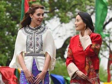 Britain's Kate  Duchess of Cambridge, left,  and The Queen of Bhutan Jetsun Pema walk during a visit to the Tashichho Dzong in Thimphu, Bhutan, during day five of the royal tour to India and Bhutan Thursday April 14, 2016.
