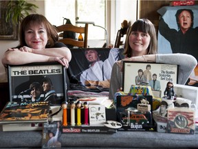 Ginger Sedlarova, left, and Jennifer Cormack pose with some of their Beatles memorabilia.