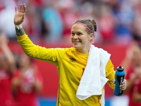 Canada goalkeeper Erin McLeod waves to fans after defeating Switzerland 1-0 in a FIFA Women's World Cup soccer match at BC Place Stadium in June 2015. McLeod will miss the Summer Olympics in Rio with a long-term knee injury.