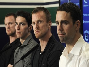 Henrik Sedin, Alex Burrows, Daniel Sedin and Dan Hamhuis talk to media as the Vancouver Canucks wrap up their unsuccessful season.