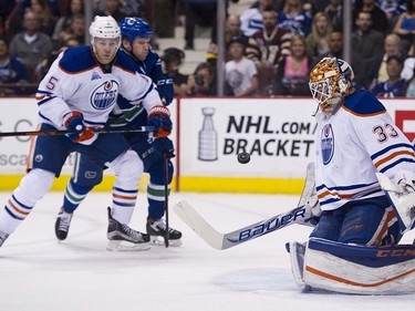 Oilers #5 Mark Fayne keeps Vancouver Canucks #15 Derek Dorsett from the rebound in front of Edmonton Oilers goalie Cam Talbot during the first period of the final regular season NHL hockey game at Rogers Arena, Vancouver April 09 2016. ( Gerry Kahrmann  /  PNG staff photo)  ( For Prov / Sun Sports )  00042613A  [PNG Merlin Archive]