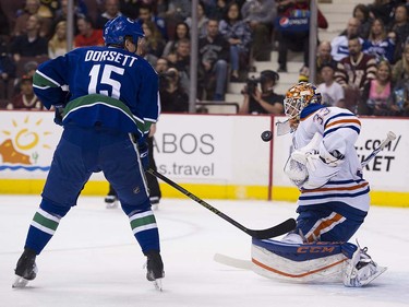 Vancouver Canucks #15 Derek Dorsett looks for the rebound in front of Edmonton Oilers goalie Cam Talbot during the first period of the final regular season NHL hockey game at Rogers Arena, Vancouver April 09 2016. ( Gerry Kahrmann  /  PNG staff photo)  ( For Prov / Sun Sports )  00042613A  [PNG Merlin Archive]
