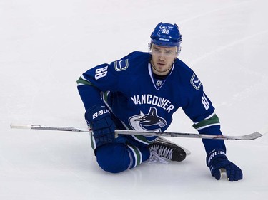 Vancouver Canucks #88 Nikita Tryamkin stretches during the pre game skate prior to playing the Edmonton Oiler in the final regular season NHL hockey game at Rogers Arena, Vancouver April 09 2016. ( Gerry Kahrmann  /  PNG staff photo)  ( For Prov / Sun Sports )  00042613A  [PNG Merlin Archive]