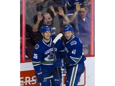 Vancouver Canucks #36 Jannik Hansen and#41 Ronalds Kenins celebrate Hansen's goal on the Edmonton Oilers during the third period of the final regular season NHL hockey game at Rogers Arena, Vancouver April 09 2016. ( Gerry Kahrmann  /  PNG staff photo)  ( For Prov / Sun Sports )  00042613A  [PNG Merlin Archive]