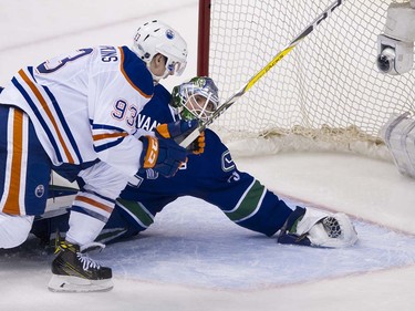 Edmonton Oilers #93 Ryan Nugent-Hopkins beats Vancouver Canucks goalie Jacob Markstrom to score during the third period of the final regular season NHL hockey game at Rogers Arena, Vancouver April 09 2016. ( Gerry Kahrmann  /  PNG staff photo)  ( For Prov / Sun Sports )  00042613A  [PNG Merlin Archive]