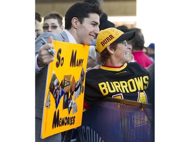 Canucks player #14 Alexandre Burrows has his photo taken with a fan at Pat Quinn Way outside Rogers Arena prior to the last game of the regular season, Vancouver April 09 2016. ( Gerry Kahrmann  /  PNG staff photo)  ( For Prov / Sun Sports )  00042648A  [PNG Merlin Archive]