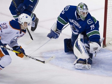 Edmonton Oilers #93 Ryan Nugent-Hopkins beats Vancouver Canucks goalie Jacob Markstrom to score during the third period of the final regular season NHL hockey game at Rogers Arena, Vancouver April 09 2016. ( Gerry Kahrmann  /  PNG staff photo)  ( For Prov / Sun Sports )  00042613A  [PNG Merlin Archive]