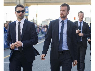 Canucks players #2 Dan Hamhuis #22 Daniel Sedin and #33 Henrik Sedin arrive to meet fans at Pat Quinn Way outside Rogers Arena prior to the last game of the regular season, Vancouver April 09 2016. ( Gerry Kahrmann  /  PNG staff photo)  ( For Prov / Sun Sports )  00042648A  [PNG Merlin Archive]