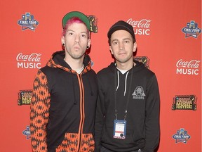 Musicians Josh Dun (L) and Tyler Joseph of Twenty One Pilots pose backstage during the Coke Zero Countdown at the NCAA March Madness Music Festival Day 2 at on April 2, 2016 in Houston, Texas.