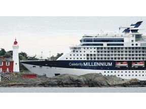 The Celebrity Millennium seems to almost touch the historic Fisgard Lighthouse at the mouth of Esquimalt Harbour on Tuesday, but the closeness is a camera-lens illusion.