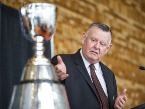 B.C. Lions owner David Braley looks at the CFL’s championship trophy as part of the 2014 Grey Cup festivities in 2014.