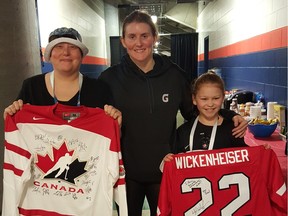 Emily Gordon poses for a photo with her mom, Sheryl Sadorski, and Team Canada's Hayley Wickenheiser at the women's world hockey championships in Kamloops. — Hockey Canada ORG