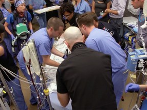 Medical staff try to save a patient in the emergency room of Vancouver General Hospital.