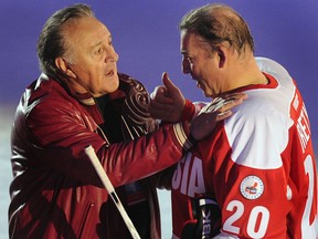 Phil Esposito (left) has a word with former Soviet goaltending star Vladislav Tretiak at a 2012 event celebrating the Summit Series.