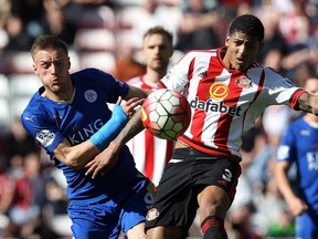 Leicester City's English striker Jamie Vardy, left, battles with Sunderland's Dutch defender Patrick van Aanholt during the English Premier League football match between Sunderland and Leicester City at the Stadium of Light in Sunderland.