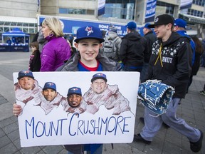 Findley Michel shows just how excited he is about a new Toronto Blue Jays season outside the Rogers Centre on Friday, April 8, 2016, the day of the Jays’ home opener against the Boston Red Sox. The Jays’ home-opening series against the Bosox averaged 1.2 million TV viewers across Canada.
