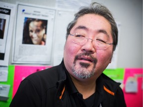 Andy Mori, info clerk at Carnegie Community Centre, is pictured at the Centre in the DTES in Vancouver, British Columbia on April 6, 2016. The message board is meant to connect residents of the Downtown Eastside neighbourhood with each other since most have limited access to internet and phones.