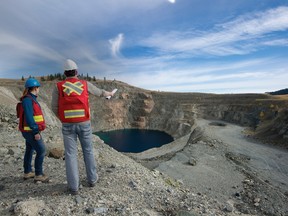 Geologist Renee Potvin and environmental scientist Rob Maciak looking over the site of KGHM Internationals proposed Ajax copper and gold mine.