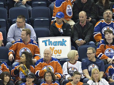Fans shows their support as he watches the final game at Rexall Place as the Vancouver Canucks play the Edmonton Oilers during second period NHL action in Edmonton, Alta., on Wednesday April 6, 2016. THE CANADIAN PRESS/Jason Franson