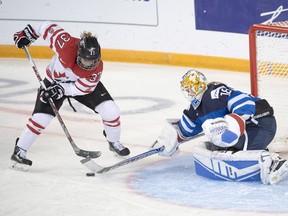 Canada's Sarah Davis (37) is stopped by Finland's goaltender Meeri Raisanen during second period semifinal action at the women's world hockey championships in Kamloops, B.C., on Sunday, April 3, 2016.