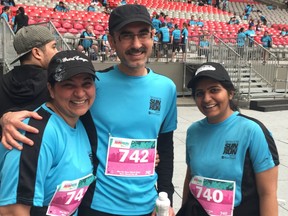 Almas Meherally, Riaz Merchant and Sanna Meherally at BC Place after completing the Vancouver Sun Run.