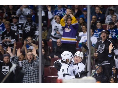 Los Angeles Kings' Tyler Toffoli, right, celebrates his goal against the Vancouver Canucks with teammate Jeff Carter during the first period of an NHL hockey game in Vancouver, B.C., on Monday April 4, 2016.