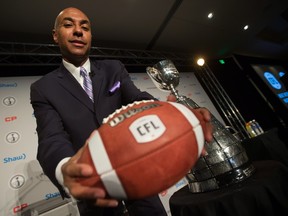CFL commissioner Jeffrey Orridge, pictured last fall showing off his league’s revamped logo of a white-shaped ’football’ with the pointy ends snipped off, has some ideas on how to modernize the circuit.