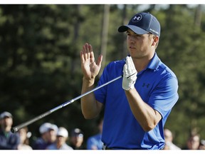 Jordan Spieth indicates how far he miss a putt for par on the 17th green on the during the second round of the Masters golf tournament Friday, April 8, 2016, in Augusta, Ga.