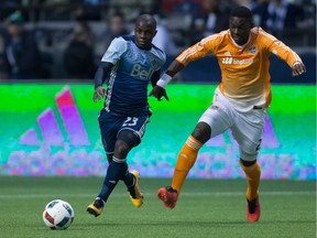 Kekuta Manneh of the Vancouver Whitecaps, left, moving the ball past Jalil Anibaba of the Houston Dynamo last month at B.C. Place, said his MLS side is well aware that it's not scoring or winning, adding: 'It's too soon to be discouraged.'