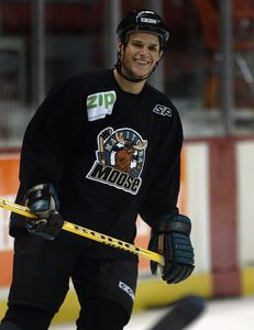 Ken Gigliotti / WINNIPEG FREE PRESS / Nov 5 2004- LAWLESS STORY- Manitoba Moose player Kevin Bieksa in practice with cut on his eyebrow one of many banged up Moose players at the Wpg Arena practice , and stikll smiling -kg [PNG Merlin Archive]