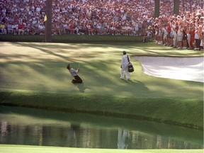 Greg Norman of Australia sinks to his knees on the 15th green after narrowly missing the hole with his chip shot during the final round of the 1996 Masters at Augusta National Golf Club in Augusta, Ga. Norman, who took a six-stroke lead into the final round, collapsed on Sunday, enabling Nick Faldo to surge to a five-stroke victory.