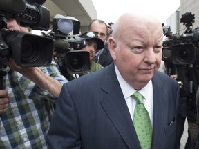 Sen. Mike Duffy walks past the cameras as he leaves the courthouse after being acquitted on all charges, Thursday, April 21, 2016 in Ottawa.