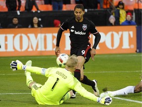 Apr 9, 2016; Washington, DC, USA; Vancouver Whitecaps defender Fraser Aird (8) passes the ball as D.C. United midfielder Nick DeLeon (14) defends during the first half at Robert F. Kennedy Memorial.