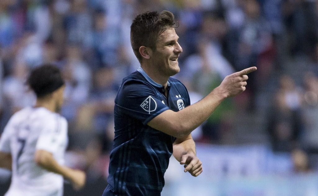 Sporting Kansas City forward Diego Rubio (9) celebrates his goal against the Vancouver Whitecaps .