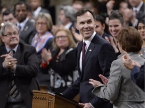 Finance Minister Bill Morneau receives applause as he tables the federal budget in the House of Commons in Ottawa on Tuesday, March 22, 2016.