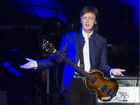 Paul McCartney gestures to the crowd as he walks on stage at Rogers Arena, Vancouver April 19 2016.