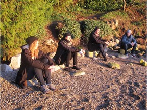 Left to right: Lauren Noon, Riki-Kay Middleton, Will Pursell and Chris Anthon enjoy the setting sun at Maple Beach.