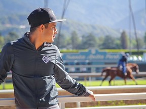 Horse racing jockey Mario Gutierrez takes a break at Santa Anita Park racetrack in Arcadia, Calif., on April 16, 2016.