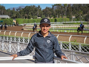 Horse racing jockey Mario Gutierrez takes a break at Santa Anita Park racetrack in Arcadia, Calif., on April 16, 2016.