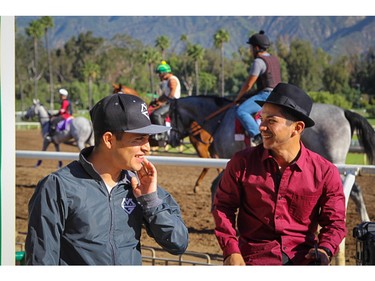 Horse racing jockey Mario Gutierrez (left) with his friend Fernando Perez at the Santa Anita Park racetrack in Arcadia, Calif., on April 16, 2016.