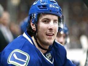 Canucks defenceman Andrey Pedan will be all smiles, now that he's re-signed with the Canucks for another season.